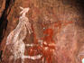 Aboriginal rock art: Hunter with spear and atlatl killing kangaroo, Nanguluwur Gallery - Kakadu National Park, Northern Territory
