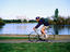 Cyclist beside Lake Burley Griffin.