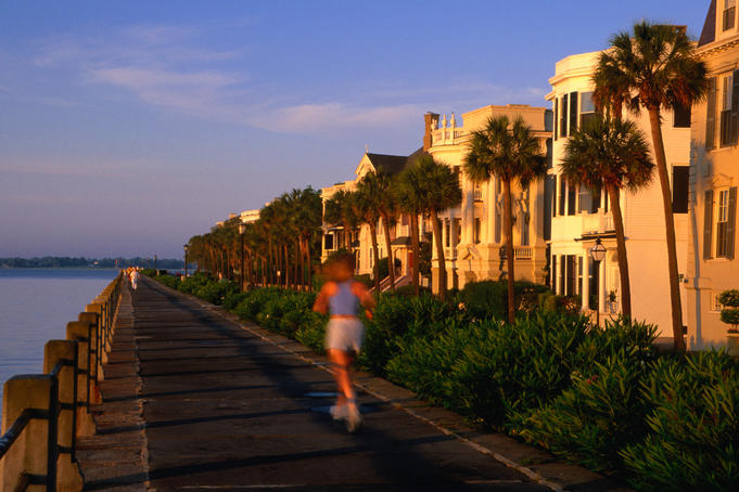 Female jogger on an early morning at Battery seawall.