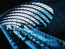 Escalators and glassed in roof at Canary Wharf Underground Station.