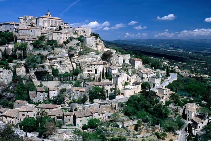 Provence. Tiered Vaucluse village of Gordes sits on a white rocky hill.