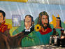 Mural on wall depicting religous and patriotic figures.
