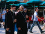 Priests walking along waterfront near San Marco.