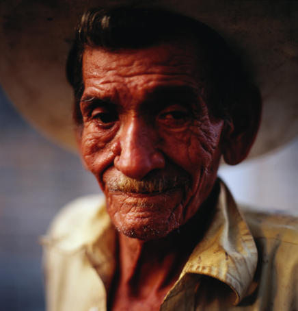 Portrait of elderly man in cowboy hat.