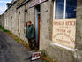 Man outside village shop, Uyeasound.