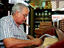 Cigar maker at work.
