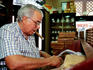 Cigar maker at work.