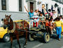 Crowds in the street in a horse and cart as part of the New Year celebrations - Popayan, Cauca