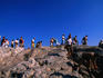 Tourists on Areopagus Hill at the Acropolis.