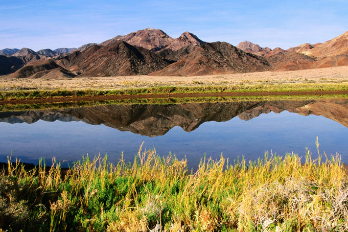 Lagoon, desert and mountains.