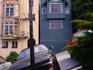 Cars and houses on an angle on sloping Filbert Street.