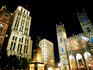 Place d'Armes and Notre-Dame Basilica illuminated at night.