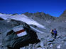 Giant painted waymark on boulder in Grand Desert basin on The Haute Route walk.
