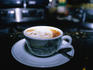 Cafe latte containing a frothy smile.