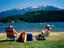 Couple relaxing on shore of Alta Lake, Rainbow Park.