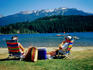 Couple relaxing on shore of Alta Lake, Rainbow Park.