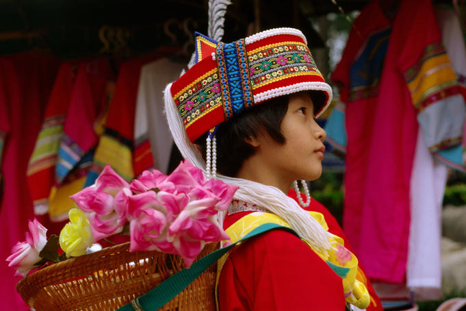 Girl in traditional costume, Stone Forest.