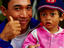 Father and daughter at Pasar Badung.