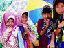 Group of young girls, Kampong scene.