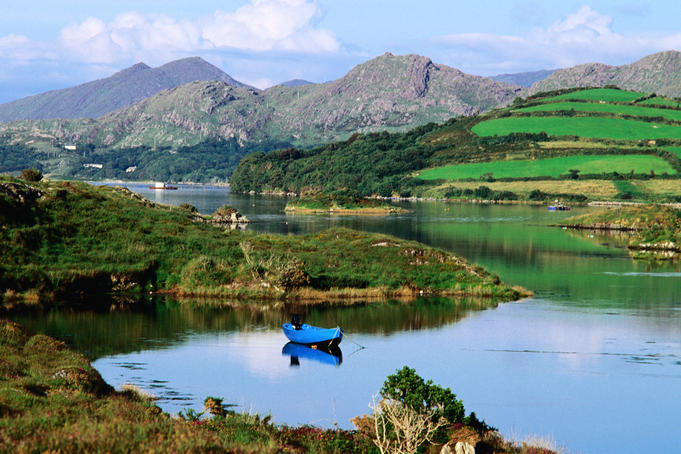 Blue boat on tranquil Kenmare River.