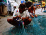 Fishermen repairing nets, Sasoon Dock.