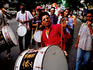 Drummer leading procession during Ganesh Chaturthi festival celebrations.