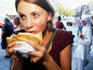 Girl eating doner kebab in Kreuzberg.