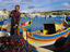 Fisherman with net at harbour.