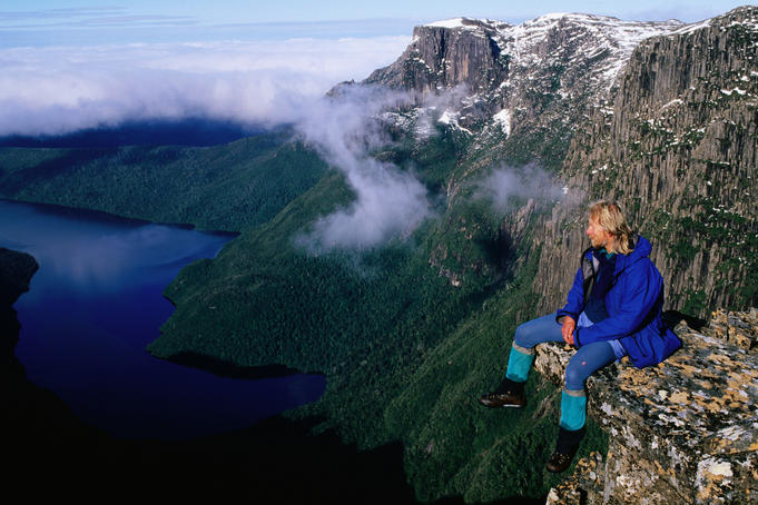 Hiker looking down at lake in Anne Range.