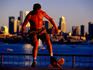 Skateboarder with city skyline in background, Gasworks Park, Fremont.