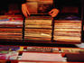 Customer looking at records in the Wall of Sound Records/ Confounded Books shop in the Pike/ Pine Corridor.