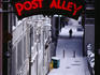 Man walking down Lower Post Alley.