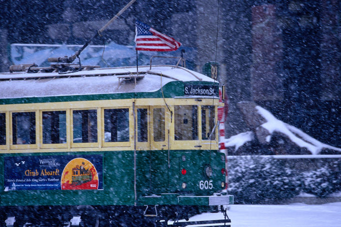 Tram in snow on Alaskan Way.