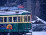 Tram in snow on Alaskan Way.
