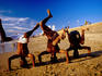 Boy performing handstands on Galle Face Beach.