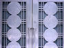 Detail of art-deco door on Design Exchange building, depicting city's historical occupations.
