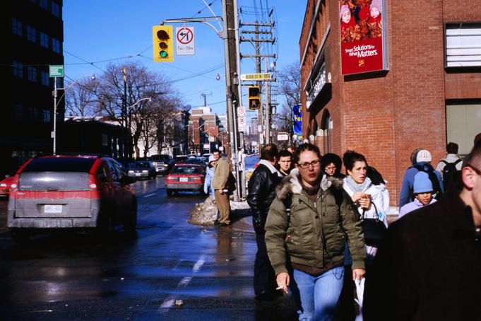 Pedestrians and traffic along Bloor St in The Annex.