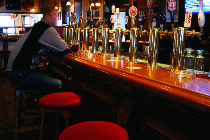Customer at bar of Madison Avenue pub.