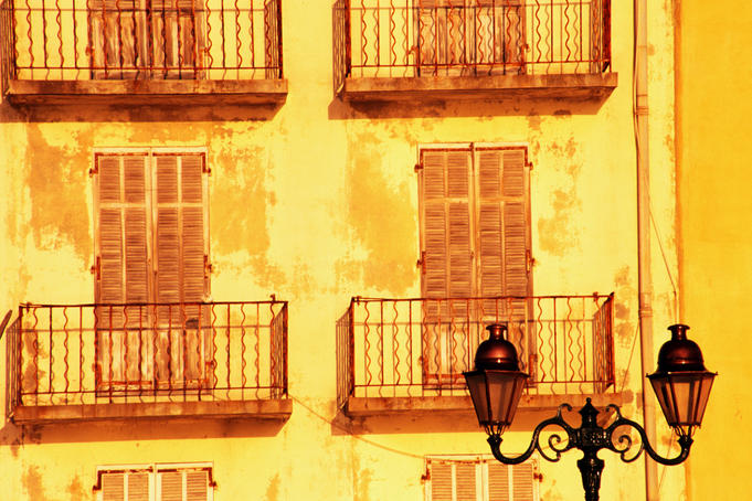 Shutters and balconies on building on Quai Frederic Mistral.