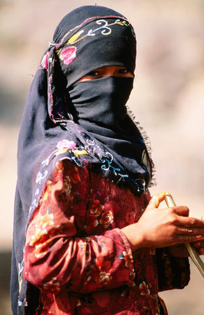 Portrait of Muslim woman in headscarf.