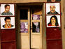 Painted advertisements outside a hairdresser's shop, Komoguel.