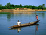 Two boys poling a pirogue (dugout), Niger River.