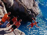 Teenagers jumping into sea from Pointe des Ponchettes.