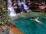 Man relaxing in pool at base of Pacheco Falls, Quebrada Pacheco.