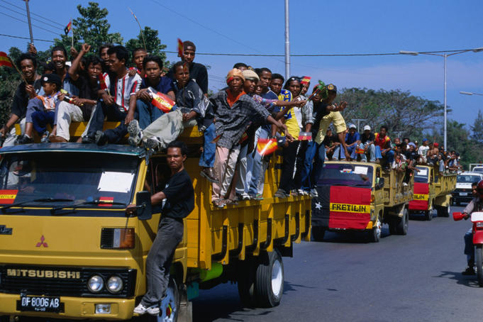 Procession of trucks of Fretilin Party supporters prior to election.
