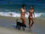 'Tall and tan and young and lovely'...two women walking along Ipanema Beach.