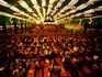 Overhead of Oktoberfest beer-drinking session in tent at Theresienwiese fairgrounds.