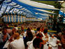 Overhead of Oktoberfest beer-drinking session in tent at Theresienwiese fairgrounds.
