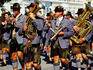 Male marching band in traditional costume during Oktoberfest.