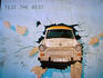 Mural on Berlin Wall of Trabant.
